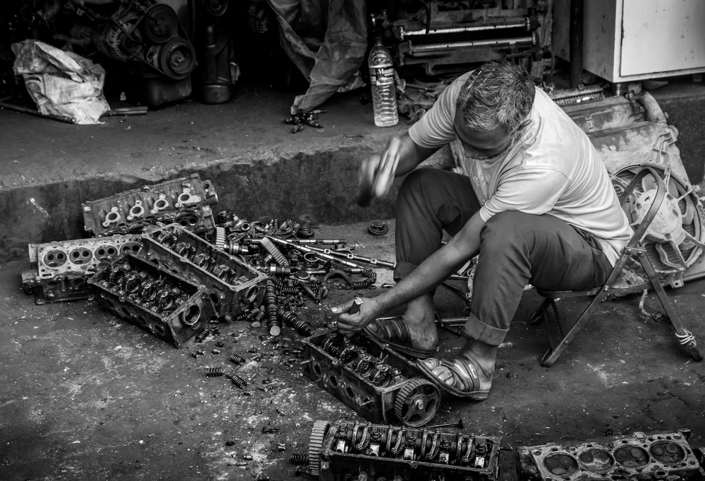 Mechanic working with engine parts